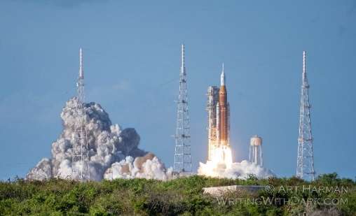 Artemis II rocket rising from the launch pad at Kennedy Space Center