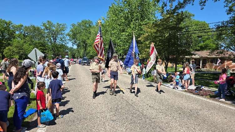 Scouts carry flags in a holiday parade